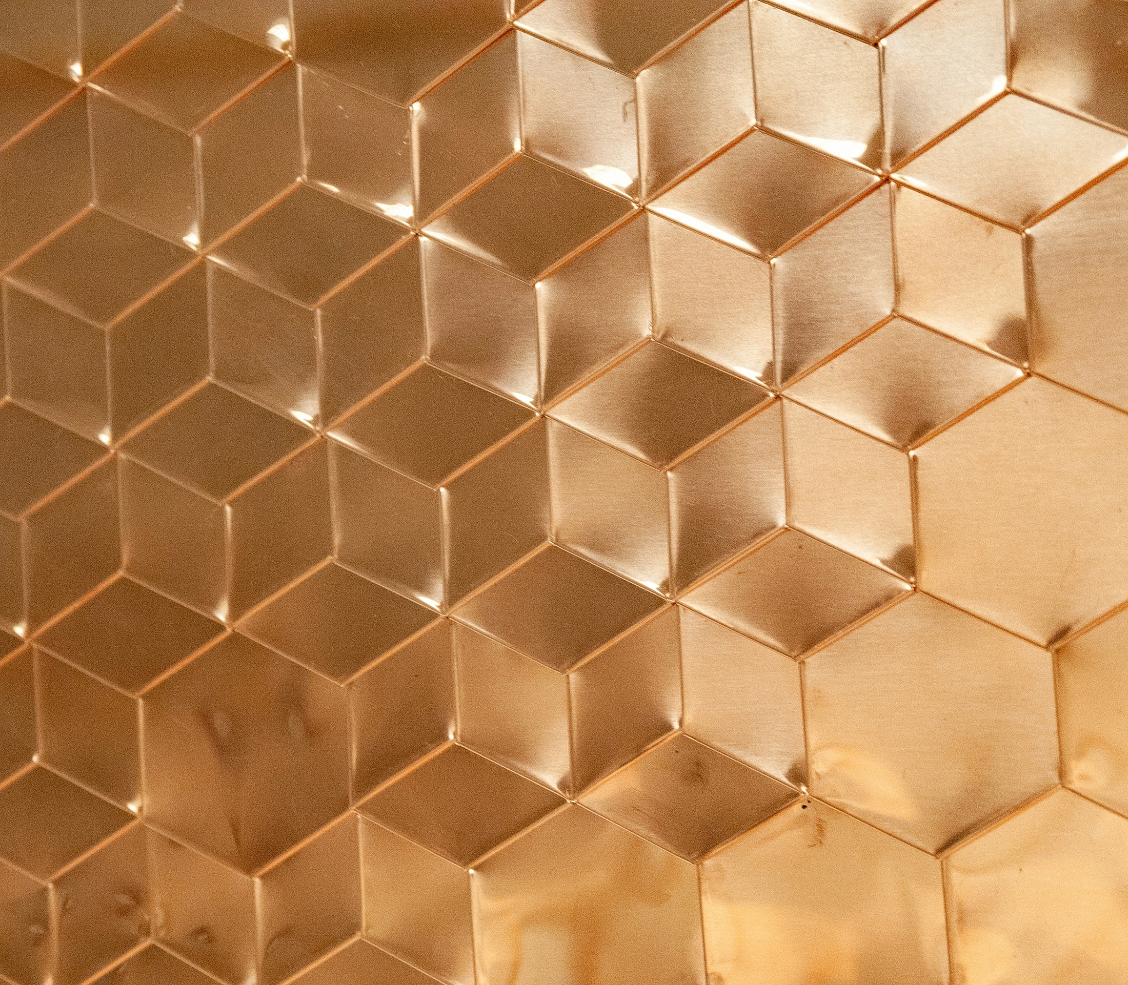 Textured metallic honeycomb pattern in warm tones