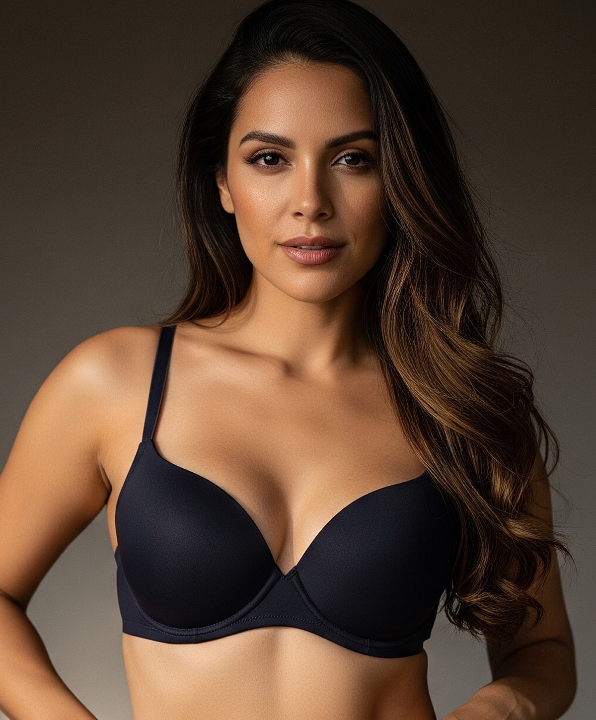 Model wearing a black plunge bra.
