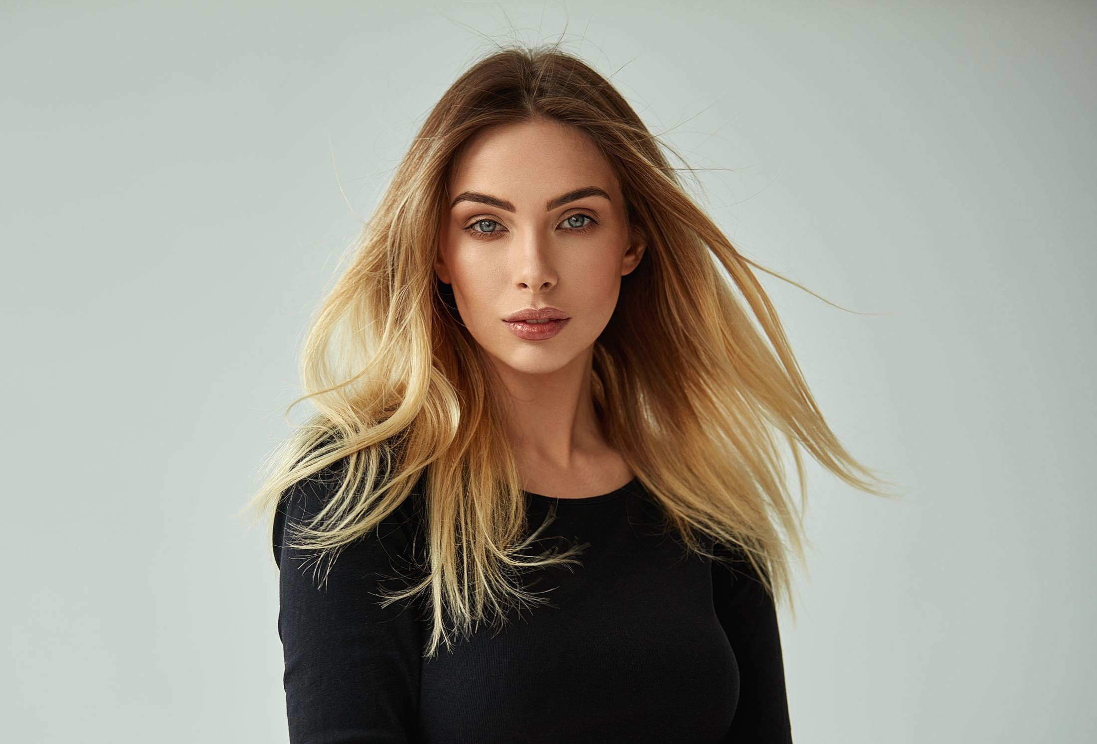 Portrait of a woman with flowing hair.