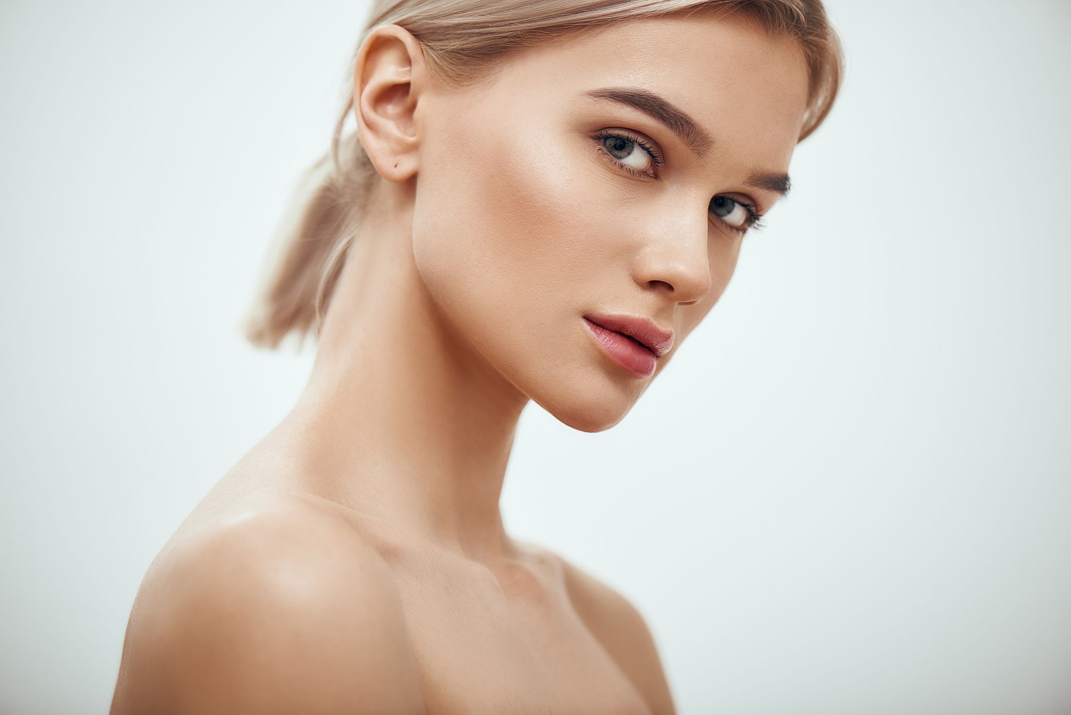 Profile of a woman with natural makeup.